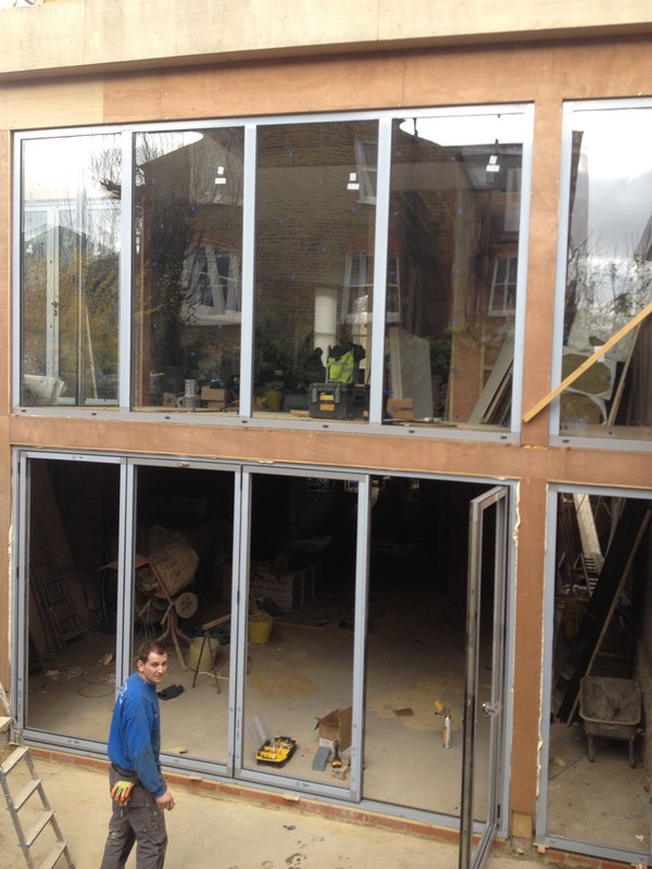 Aluminium bi-fold doors with two-storey glazing in Deptford